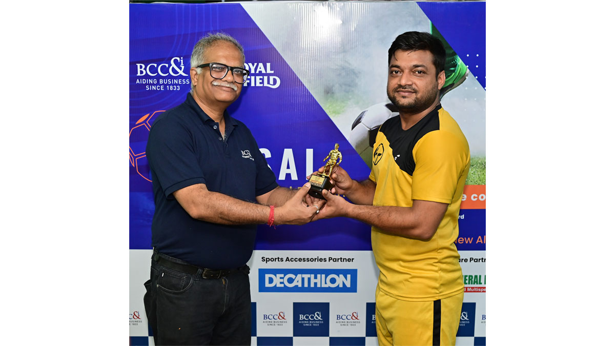 Mr. Soumya Saha, Head-Finance & Governance, BCC&I handing over a Man of the Match Trophy