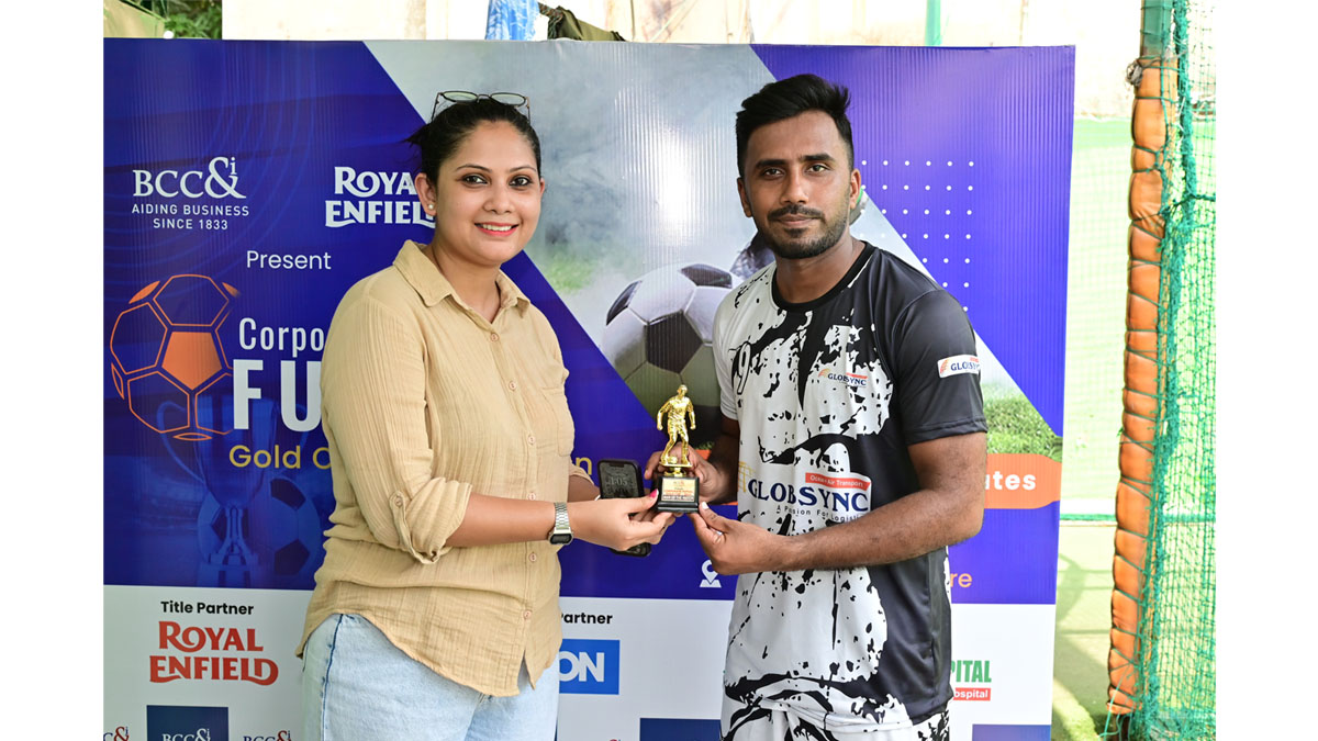 Ms. Waindrilla Saha, Manager, BCC&I handing over a Man of the Match Trophy